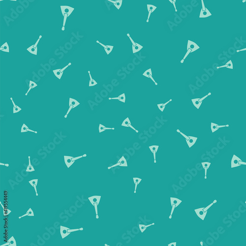 Green Musical instrument balalaika icon isolated seamless pattern on green background. Vector.
