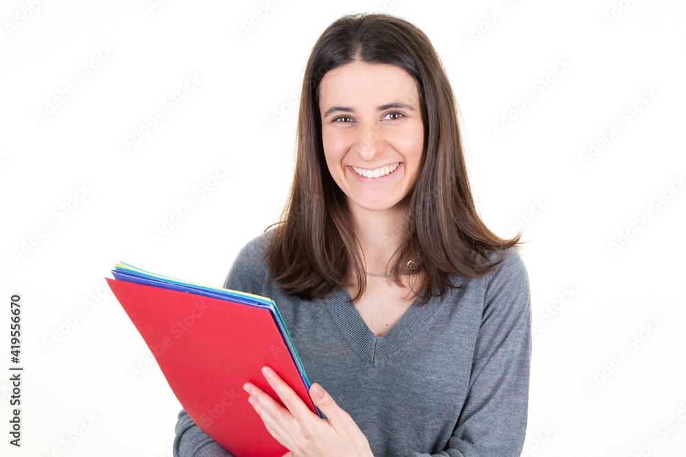 Student woman holding book and papers on white background Student woman holding book and papers on white background