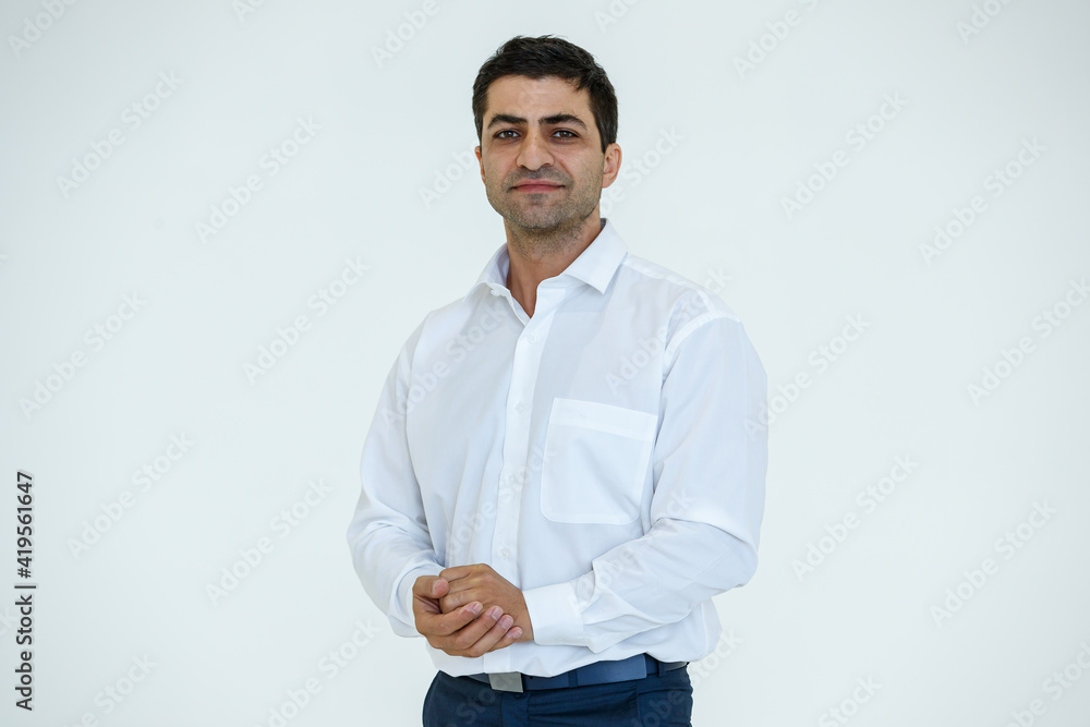 Portrait of Iranian businessman with a beard on face posing in advertising gesture with friendly and positive isolated on white background Portrait of Iranian businessman with a beard on face posing in advertising gesture with friendly and positive isolated on white background