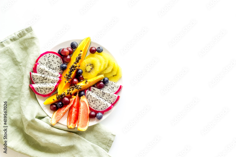 Mixed tropical exotic fruit in white dish