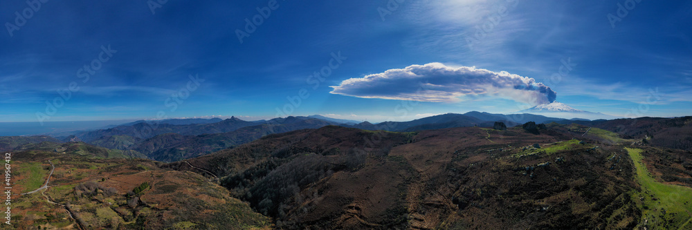 Virtual reality panorama at 180 degrees of the eruption of the Etna volcano by day 19 February 2021 seen from the megalithic complex of Argimusco near Montalbano Elicona. Paroxysm on Etna in Sicily. 