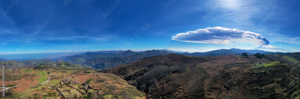 Virtual reality panorama at 180 degrees of the eruption of the Etna volcano by day 19 February 2021 seen from the megalithic complex of Argimusco near Montalbano Elicona. Paroxysm on Etna in Sicily. 