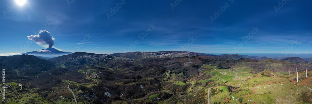 Virtual reality panorama at 180 degrees of the eruption of the Etna volcano by day 19 February 2021 seen from the Municipality of Floresta, the highest town in Sicily. Paroxysm on Etna in Sicily. 