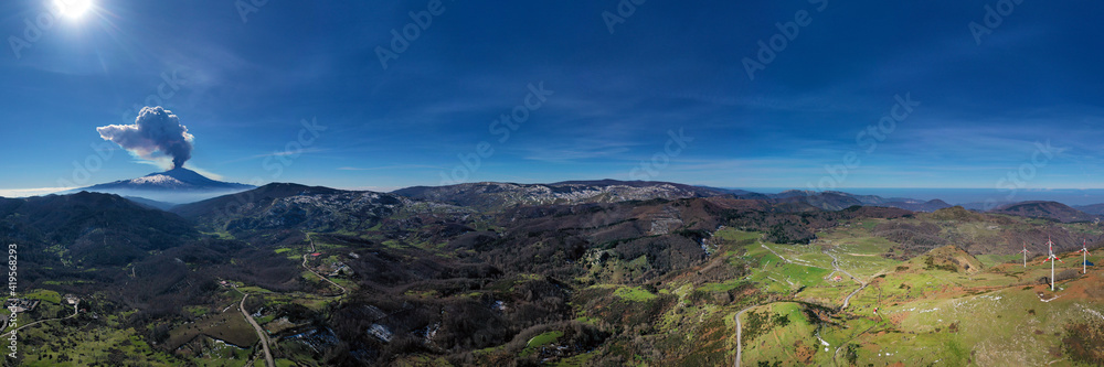 Virtual reality panorama at 180 degrees of the eruption of the Etna volcano by day 19 February 2021 seen from the Municipality of Floresta, the highest town in Sicily. Paroxysm on Etna in Sicily. Virtual reality panorama at 180 degrees of the eruption of the Etna volcano by day 19 February 2021 seen from the Municipality of Floresta, the highest town in Sicily. Paroxysm on Etna in Sicily.