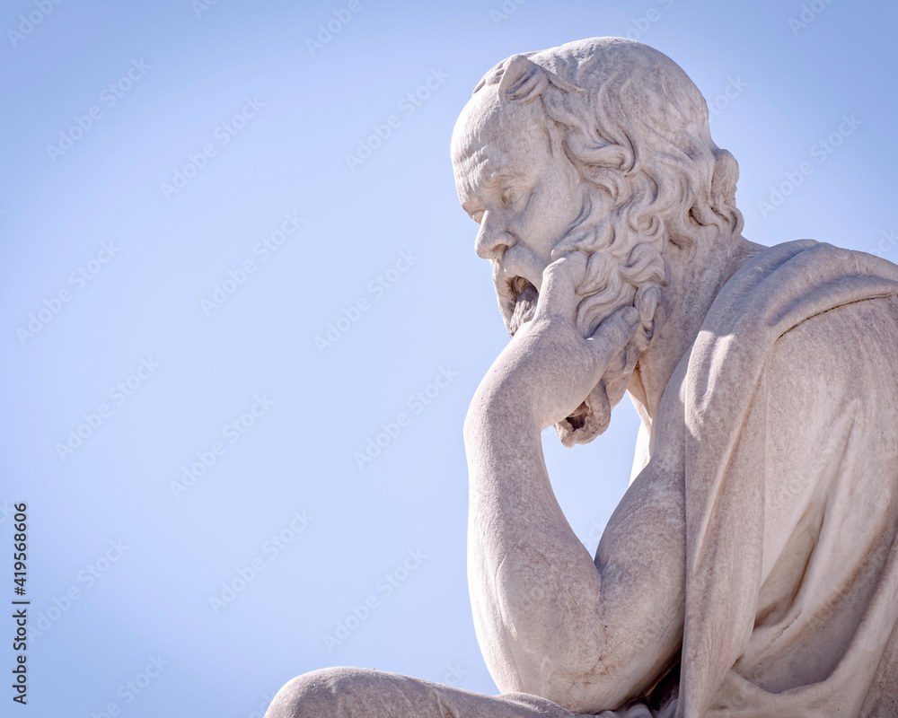 Socrates the ancient Greek philosopher and thinker white marble statue under blue sky, space for your text
