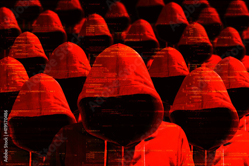 Group of hooded hackers in red cybersecurity concept