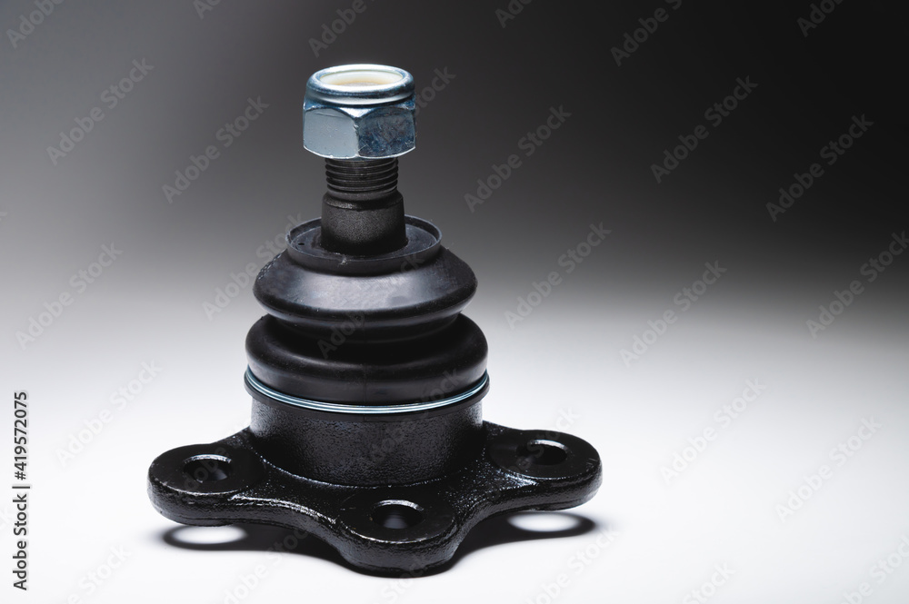 New SUV front suspension ball joint with nut on gray gradient background New SUV front suspension ball joint with nut on gray gradient background