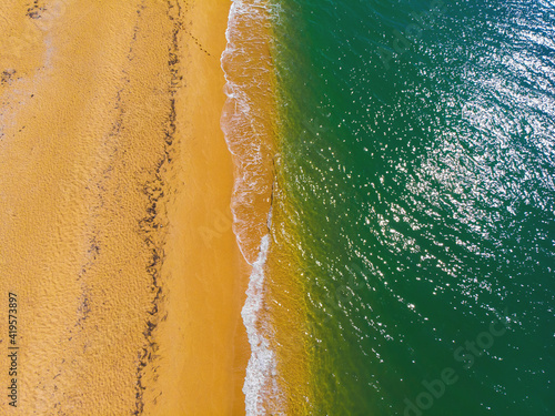 Aerial view of sunny golden beach with turquoise water top view