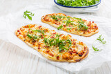Tarte Flambee - flat bread (Flammkuchen) with bacon, onion, champignon and cheese