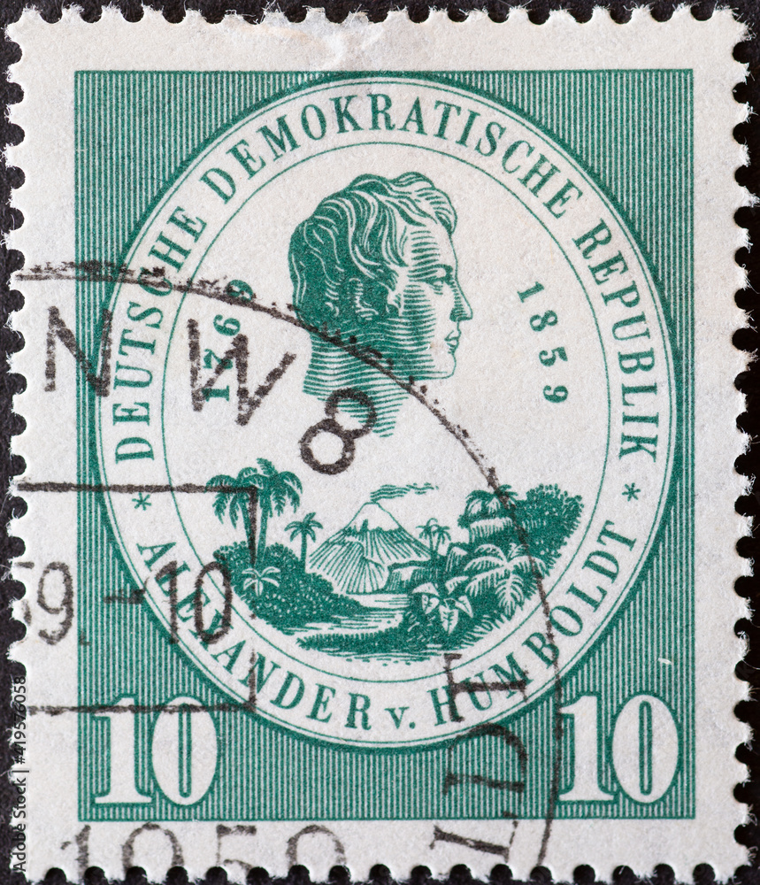 GERMANY, DDR - CIRCA 1959 : a postage stamp from Germany, GDR showing a half-portrait of the naturalist Alexander von Humboldt, Central American landscape. On the 100th anniversary of death