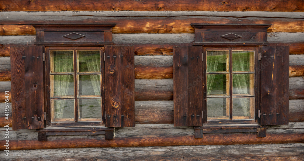 Russian Wooden Log Cabin with Wooden Shutters Russian Wooden Log Cabin with Wooden Shutters