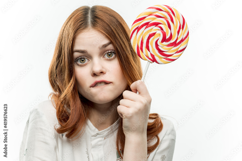 cheerful woman with a circle of colorful lollipop sweets lifestyle dessert