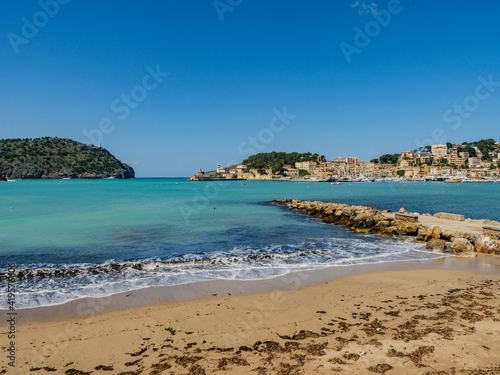 beach with trees in the village of Port de Soller on the balearic island of Mallorca, spain