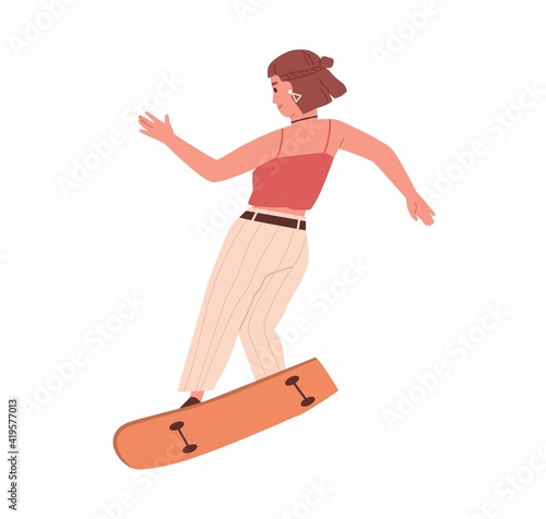 Female skateboarder riding skateboard. Young skater performing trick on long ...