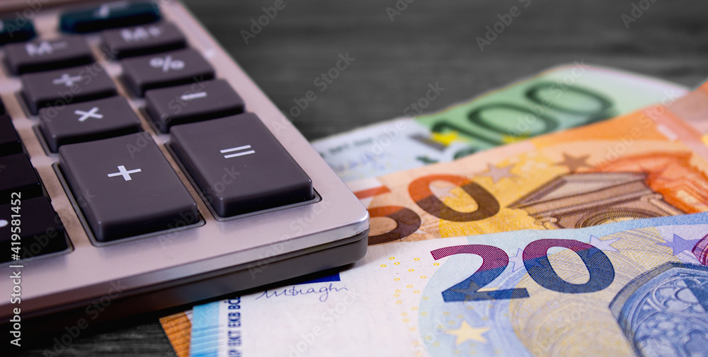 Euro close up and calculator on retro background Euro close up and calculator on retro background
