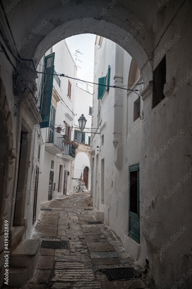 narrow alley of Ostunis oldtown, Puglia