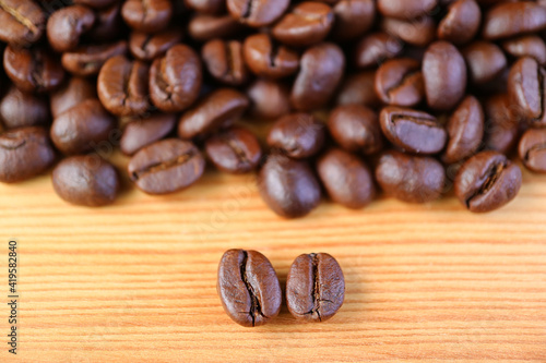 Obraz na plátně Closeup of Arabica VS Robusta Roasted Coffee Beans with Blurry Coffee Beans Pile