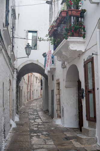 narrow alley of Ostunis oldtown, Puglia © schame87