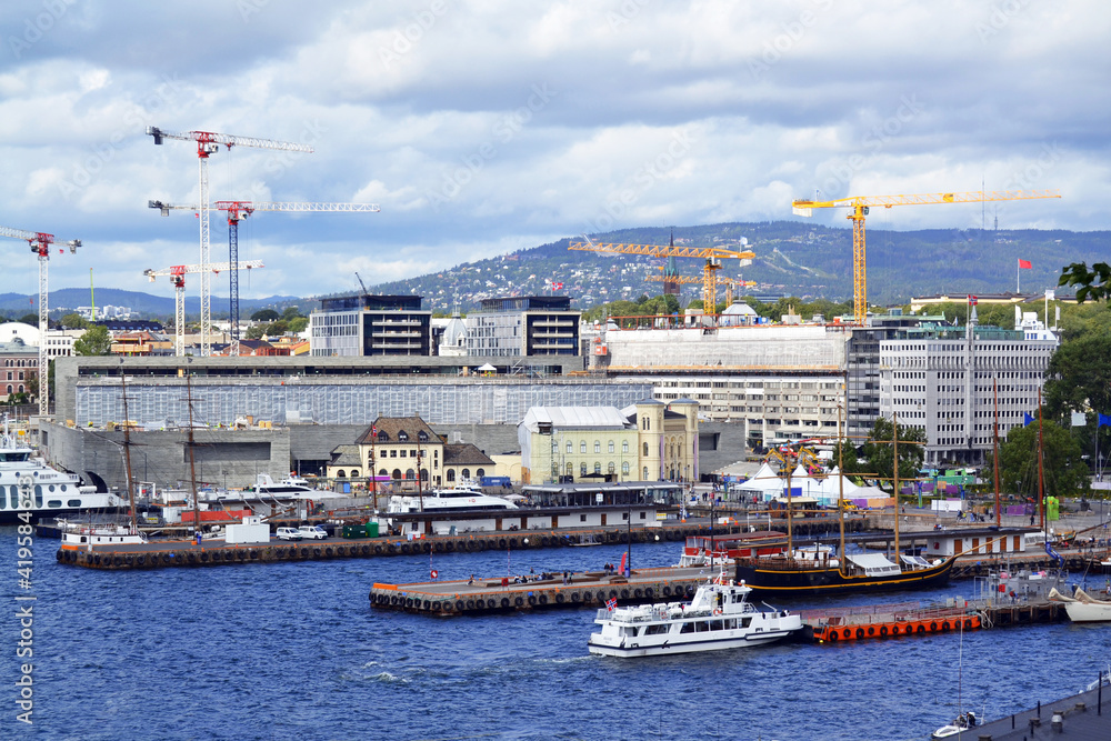 Building construction on the promenade in Oslo, Norway. Top view of the cityscape and blue North Sea