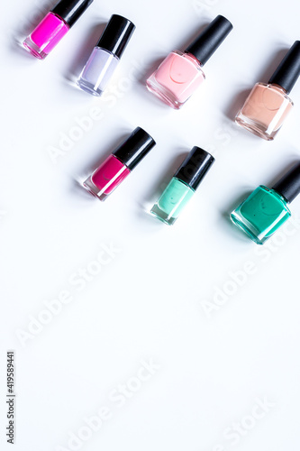 set for nail polish on white table background top view mock up