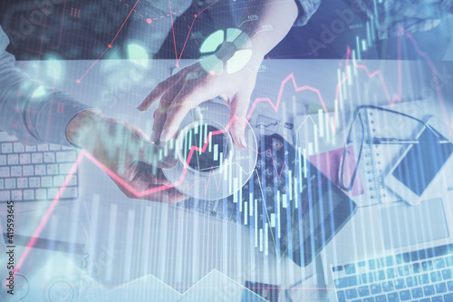 Double exposure of man and woman working together and financial chart hologram drawing. market analysis concept. Computer background. Top View.