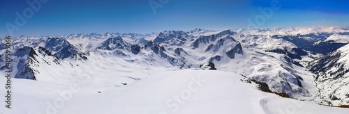 large winter panorama in the swiss mountains. Ski tours in St. Antonien. View to the Schjienflue  Partnun and Sulzfluh. Skimo