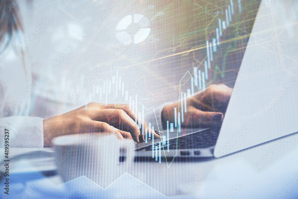 Double exposure of woman hands working on computer and forex graph hologram drawing. Financial analysis concept. Double exposure of woman hands working on computer and forex graph hologram drawing. Financial analysis concept.