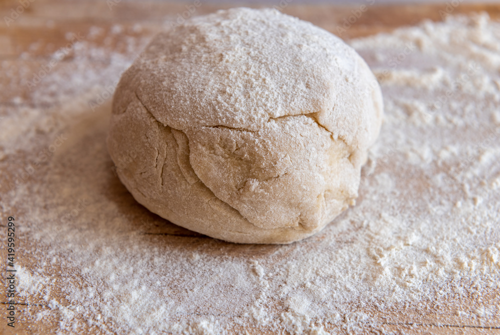 knead dough on a wooden board knead dough on a wooden board