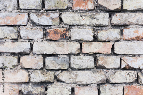 Brick wall background. Urban rustic texture. Antique house exterior wall. Vintage abandoned building architecture. Red brick construction.