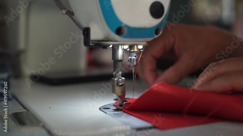Closeup Hand sewing with in factory production	