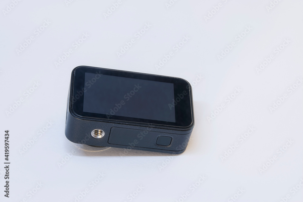 Compact action camera for shooting videos and photos on a white background. Compact action camera for shooting videos and photos on a white background.