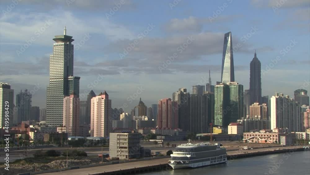 Cityscape of Shanghai, China filmed from the harbor area. Cityscape of Shanghai, China filmed from the harbor area.