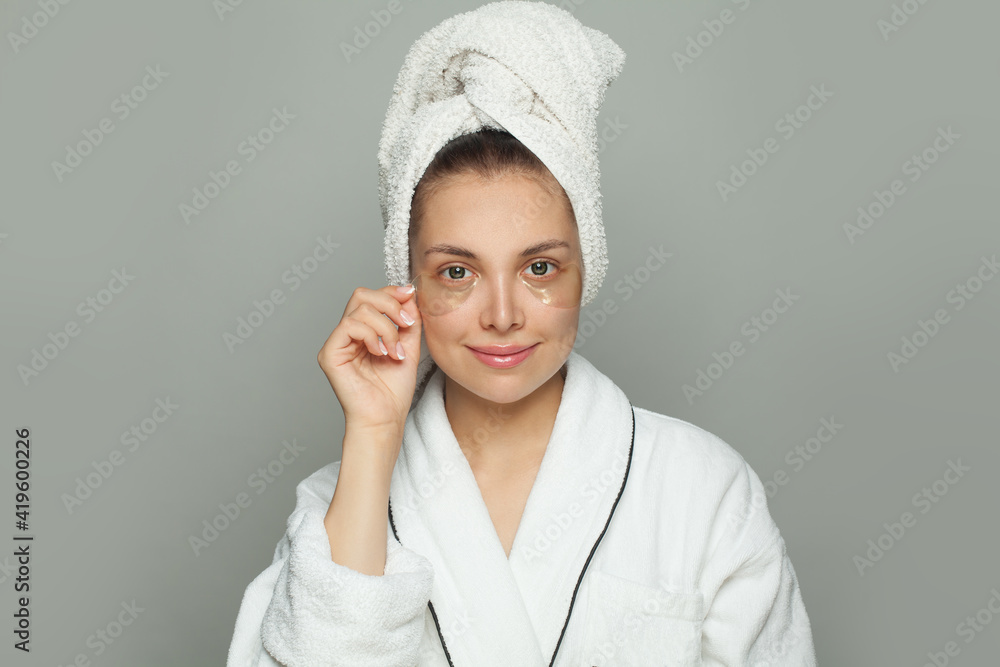 Attractive spa woman in hydrogel eye patches on her skin. Facial treatment and skin care concept Attractive spa woman in hydrogel eye patches on her skin. Facial treatment and skin care concept
