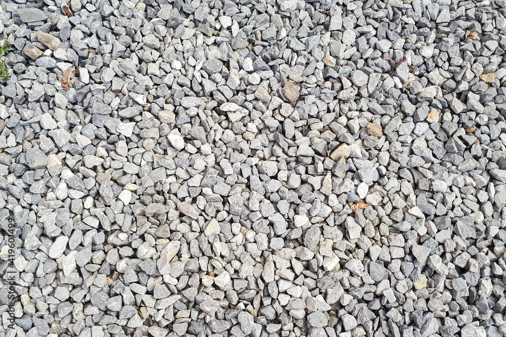 Gravel texture. Pebble stone background. Light grey closeup small rocks. Top Gravel texture. Pebble stone background. Light grey closeup small rocks. Top