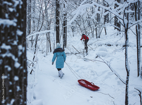 Child on a walk in the winter forest