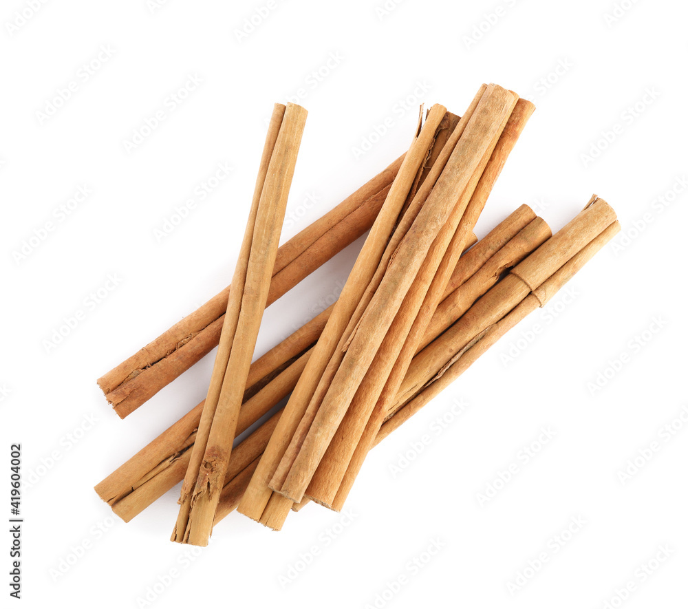 Aromatic dry cinnamon sticks on white background, top view