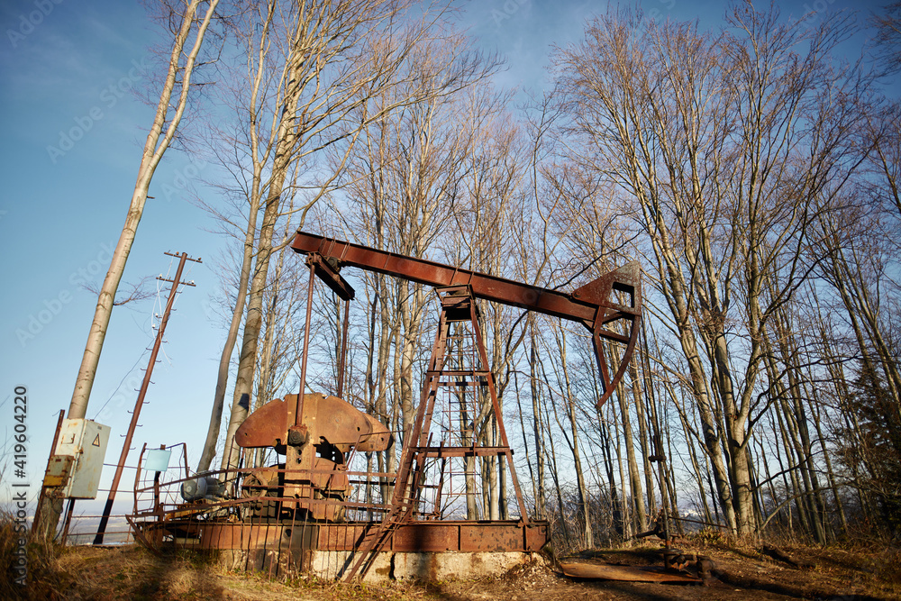 Fototapeta premium old land oil drilling rig in the forest