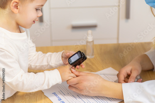 child being checked by a doctor. Selective focus