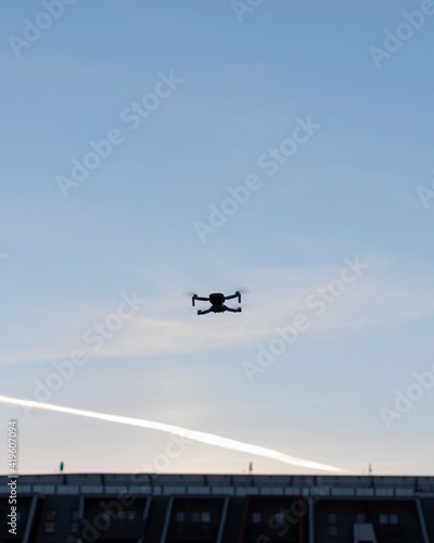 An electric drone is flying in the sky. Drone control.