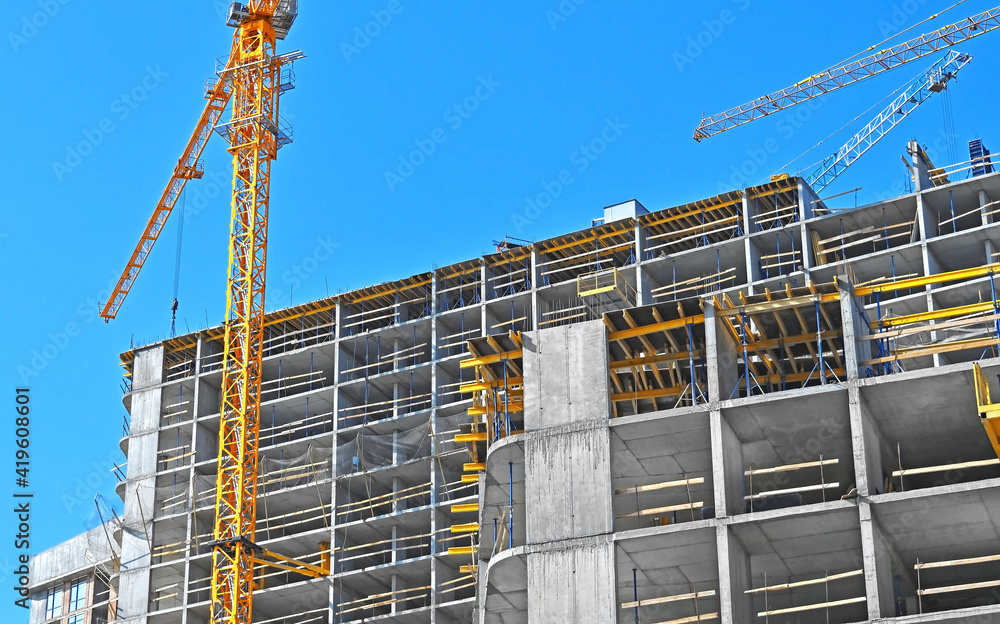 Crane and highrise construction site Crane and highrise construction site