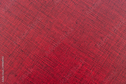 Textura de tapa de libro con entramado de líneas negras sobre fondo rojo
