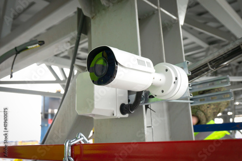 outdoor surveillance and security video camera installed on a metal structure