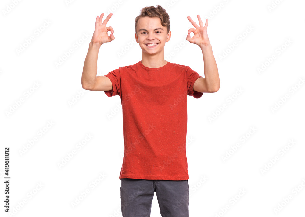 Handsome teen boy laughing looking very happy, isolated on white background. Handsome teen boy laughing looking very happy, isolated on white background.