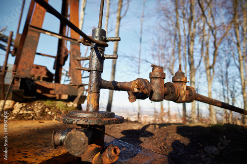 valve of the old land oil drilling rig in the forest