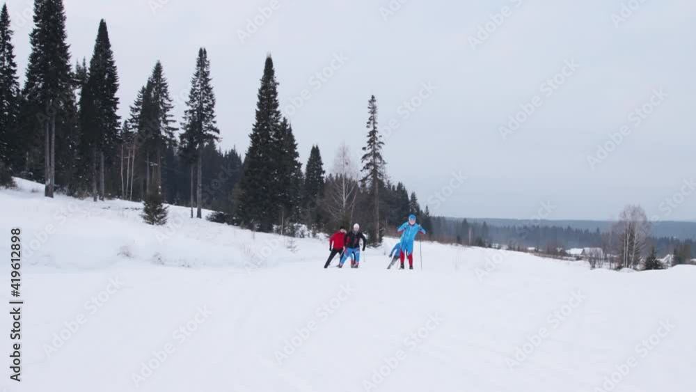 Group of young people are skiing Group of young people are skiing