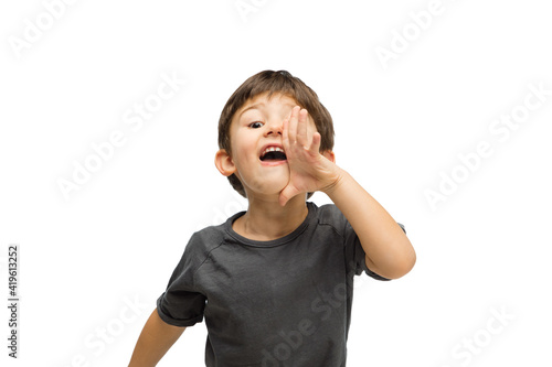 Wallpaper Mural Shouting, calling. Happy, smiley little caucasian boy isolated on white studio background with copyspace for ad. Looks happy, cheerful. Childhood, education, human emotions, facial expression concept. Torontodigital.ca