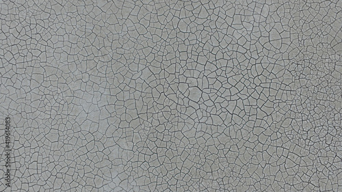 The ground has cracks in the top view for the background or graphic design with the concept of drought and death. Banner. photo