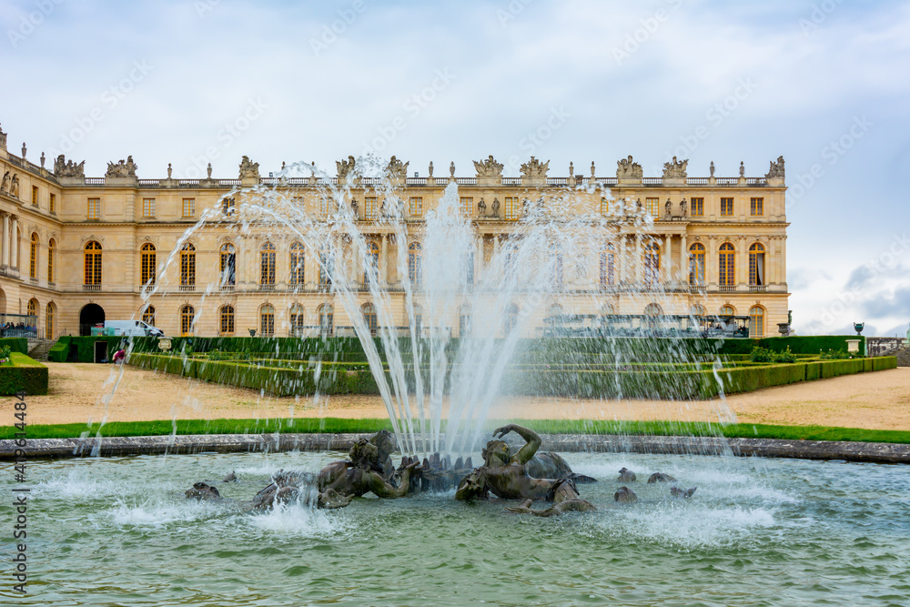 Versailles palace and fountain in formal gardens, Paris suburbs, France