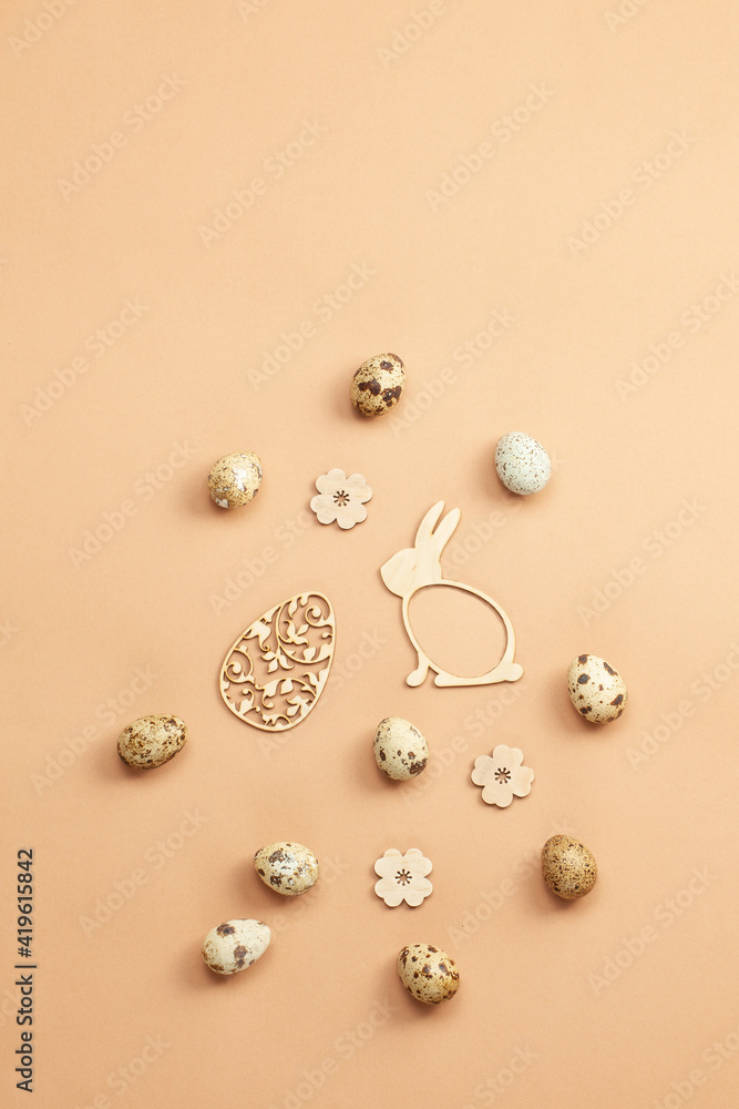 Flat lay composition with naturally dyed easter eggs,rabbit on beige background. Natural sun light lighting and soft shadows. Realistic aesthetic look. Organic natural easter concept Flat lay composition with naturally dyed easter eggs,rabbit on beige background. Natural sun light lighting and soft shadows. Realistic aesthetic look. Organic natural easter concept