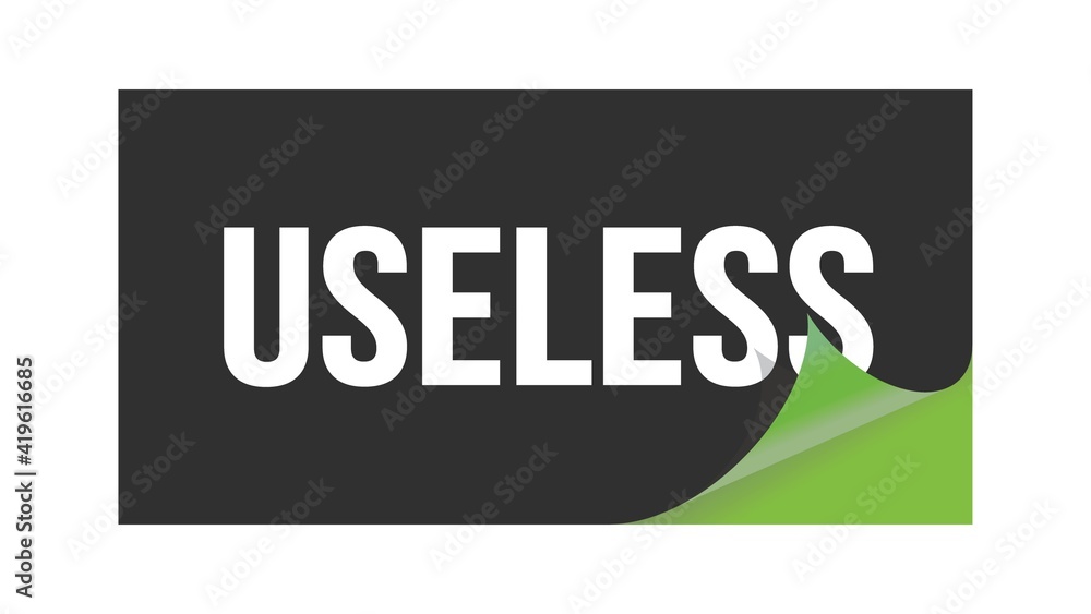 USELESS text written on black green sticker. USELESS text written on black green sticker.